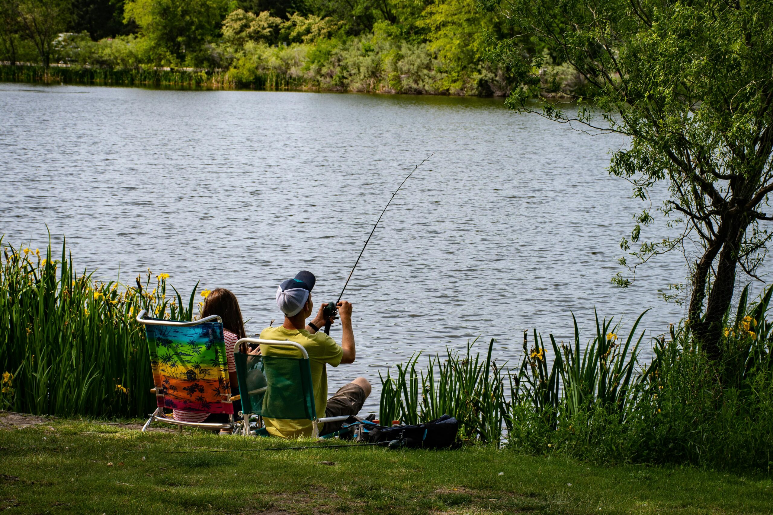 Couple fishing by the lakeside