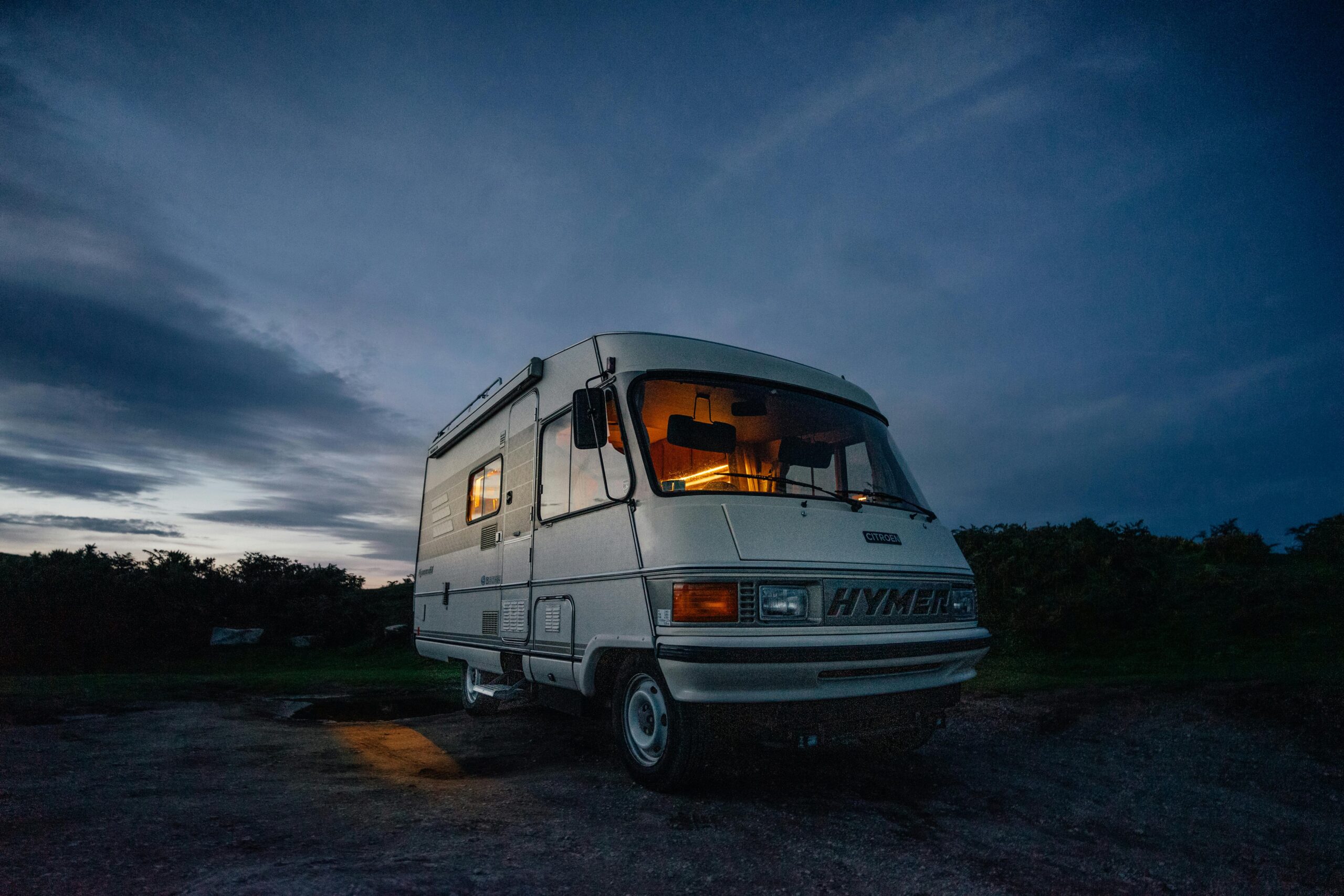 Picture of a van against a dusk sky